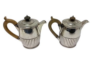 Lot 281 - George III ribbed hot water jug and a matching Victorian copy.