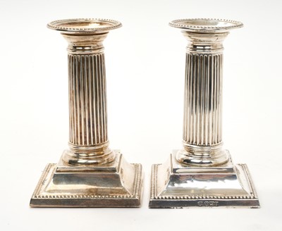 Lot 284 - Pair of Victorian fluted column candlesticks