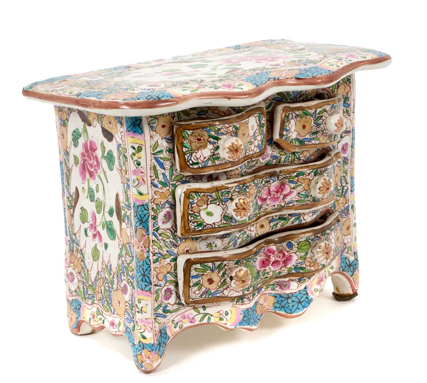 Lot 91 - Continental tin glazed miniature chest of drawers