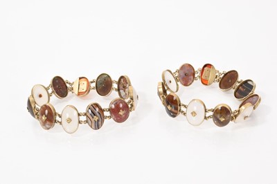 Lot 637 - Pair of Scottish pebble bracelets, each with eleven oval agate panels in yellow metal mounts, each 17cm long