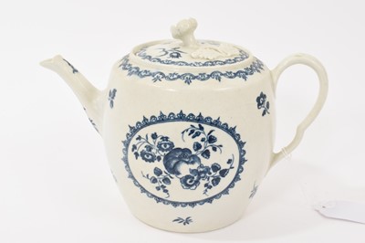 Lot 74 - A Worcester teapot and cover, circa 1770, transfer printed in blue with the Fruit and Wreath pattern, crescent mark, 15cm high