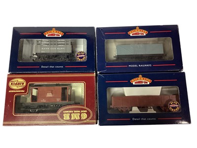 Lot 1829 - Railway OO Gauge Hornby Duplo & Others tin plate Vans, Guards Van & Open Top Wagons (12), plus various make Open Plank Wagons, flat bed trucks and other goods wagons, mainly loose, appro...