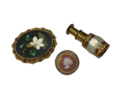 Lot 88 - 19th century pietra dura brooch in yellow metal filigree mount, 19th century carved hardstone and seed pearl brooch and a regency mother of pearl and gilt metal miniature telescope (3)