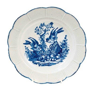 Lot 216 - A very rare Worcester plate with shaped basketweave-moulded rim, circa 1765-70, printed in blue with Hancock's 'The Birds on the Overturned Basket', crescent mark, 20.25cm diameter N.B. B...