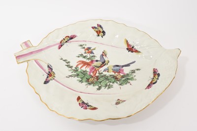 Lot 56 - A Worcester leaf shaped dish, circa 1768, polychrome painted with aggressive birds, gilt rim, 35.25cm wide