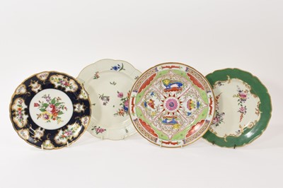 Lot 79 - A Worcester plate decorated with the Dragons in Compartments pattern, another Worcester plate with flowers on a green ground, one painted with flowers with basket weave border, and a Samson copy...
