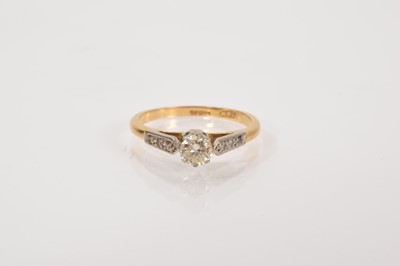 Lot 657 - Diamond single stone ring with diamond shoulders