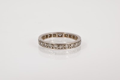 Lot 658 - Diamond eternity ring with a full band of single cut diamonds in platinum setting