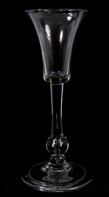 Lot 92 - A balustroid wine glass, circa 1740, the bell bowl above a drawn plain stem, having a teared baluster knop over a basal knop, on a domed folded foot, 15.8cm high