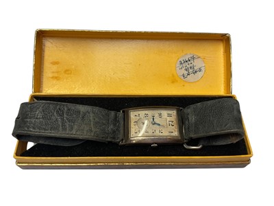 Lot 55 - Art Deco silver tank shaped wristwatch on leather strap