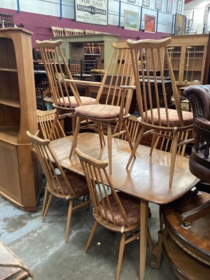 Lot 1252 - Ercol extending dining table with two extra leaves opening to 226cm x 90cm (155cm with no leaves) together with a set of eight Ercol stick back chairs including one carver