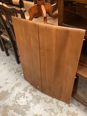 Lot 1252 - Ercol extending dining table with two extra leaves opening to 226cm x 90cm (155cm with no leaves) together with a set of eight Ercol stick back chairs including one carver