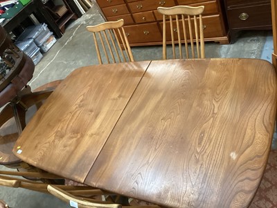 Lot 1252 - Ercol extending dining table with two extra leaves opening to 226cm x 90cm (155cm with no leaves) together with a set of eight Ercol stick back chairs including one carver