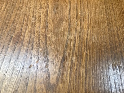 Lot 1252 - Ercol extending dining table with two extra leaves opening to 226cm x 90cm (155cm with no leaves) together with a set of eight Ercol stick back chairs including one carver
