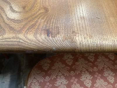 Lot 1252 - Ercol extending dining table with two extra leaves opening to 226cm x 90cm (155cm with no leaves) together with a set of eight Ercol stick back chairs including one carver