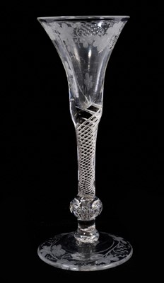 Lot 98 - An air twist glass, circa 1750, the bell bowl engraved with grapevines, over a multi spiral air twist stem, with a teared basal knop, on a domed foot etched with vines