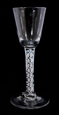 Lot 105 - A single series opaque twist wine glass, the round funnel bowl over a stem consisting of four multi-ply corkscrews (one tinged blue at the top), on a conical foot, 15.7cm high