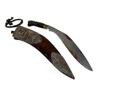 Lot 861 - Good quality Gurkha kukri with carved horn hilt, in leather scabbard with ornate silver mounts, with the blade 31cm in overall length.