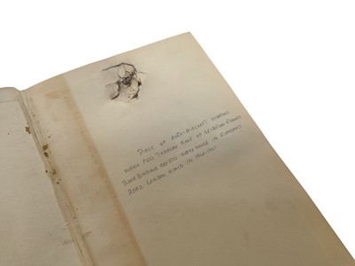 Lot 715 - Blitz interest- George Bernard Shaw 'Immaturity' with significant damage to the book, annotated 'Piece of Anti- Aircraft shrapnel