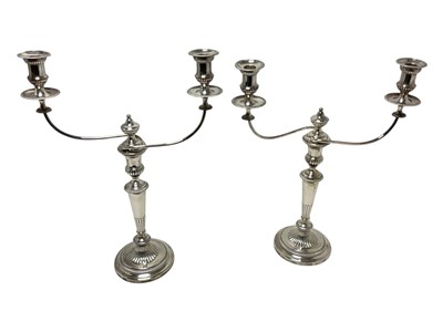 Lot 379 - Pair of Georgian silver candlesticks with Sheffield plate fittings.