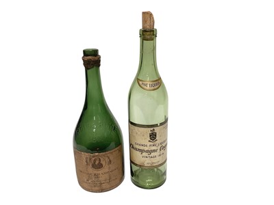 Lot 2410 - 1811 champagne bottle (empty) together with a 1914 cognac bottle (empty) (2).