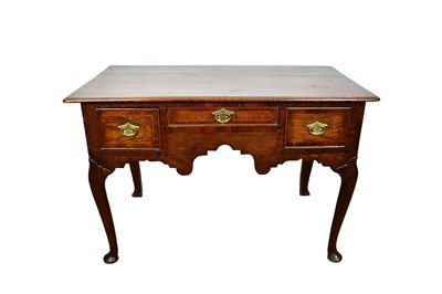 Lot 1644 - George III oak three drawer lowboy