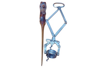 Lot 2458 - Victorian H. D. Armstrong patent steel corkscrew together with a treen page turner with glass eyes (2).