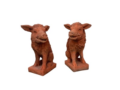 Lot 1685 - Two similar terracotta finish reconstituted stone wild boar garden statues