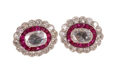 Lot 595 - Pair of diamond and ruby cluster earrings