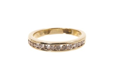 Lot 651 - Diamond eternity ring with twelve brilliant cut diamonds in 14ct yellow gold channel setting, estimated total diamond weight approximately 0.72cts.