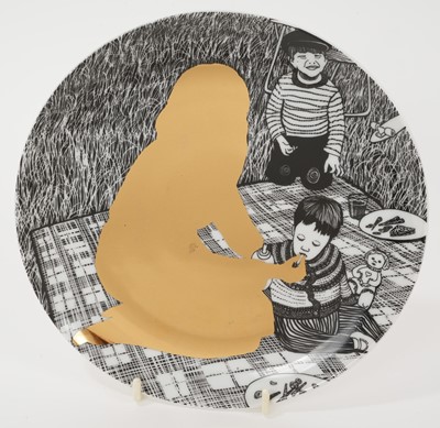 Lot 1017 - *Sir Grayson Perry CBE, RA (b.1960-), Julie as a Mother of Two porcelain plate, printed with a design depicting the gold silhouette of Julie Cope with her two children on a picnic blanket, print...