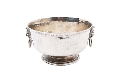 Lot 310 - Edwardian silver punch bowl with hammered finish and lion's head ring handles, London 1908
