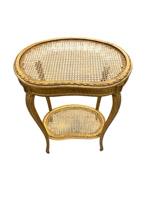 Lot 1701 - Antique French two tier kidney shaped gilt table with bergère panels to each tier