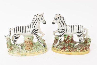 Lot 112 - Pair of Staffordshire pottery models of Zebra