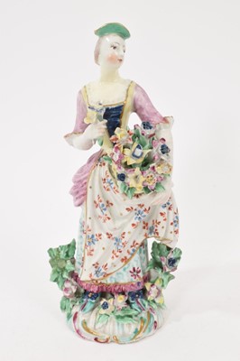 Lot 200 - Bow figure of a young woman, standing holding flowers, circa 1765