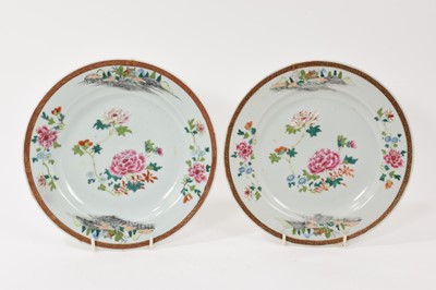 Lot 230 - Pair of Chinese Export famille rose plates, painted with flowers and landscapes, Qianlong