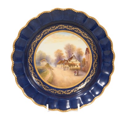 Lot 172 - Royal Worcester blue ground plate, painted by Rushton with a village scene
