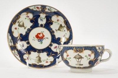 Lot 5079 - Worcester blue scale ground teacup and saucer, painted in the workshop of James Giles with urns and flowers, circa 1765-70