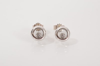 Lot 678 - Pair of Chopard 'Happy Diamonds' white gold earrings