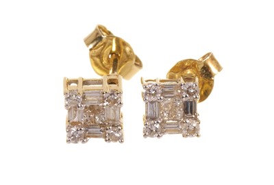 Lot 687 - Pair of diamond cluster earrings with baguette cut, princess cut and brilliant cut diamonds in a square claw setting