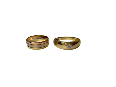 Lot 29 - Three-colour gold triple row ring (stamped 18K) and a gold single white stone ring in rub over setting (stamped 585)