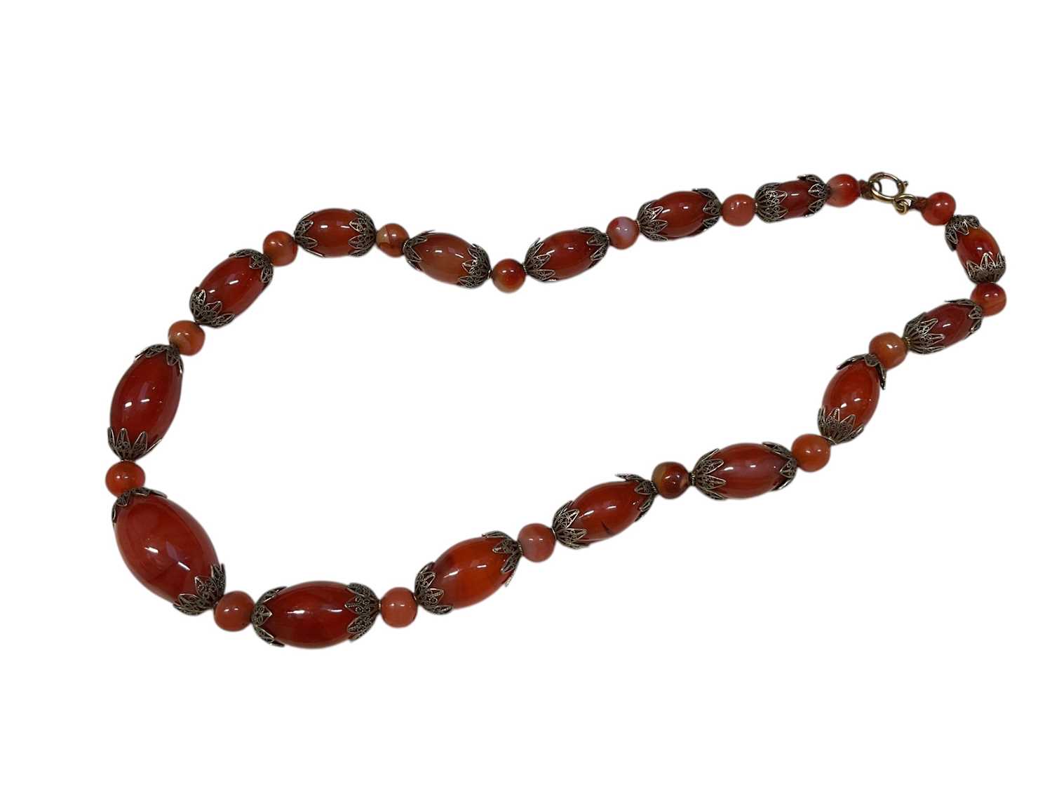 Lot 32 - 1930s carnelian bead and filigree necklace with graduated beads