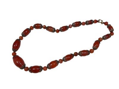 Lot 32 - 1930s carnelian bead and filigree necklace with graduated beads