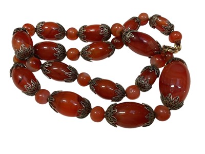 Lot 32 - 1930s carnelian bead and filigree necklace with graduated beads