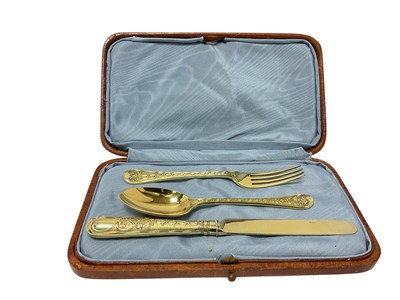 Lot 395 - Late Victorian cased, 3 piece silver gilt christening set