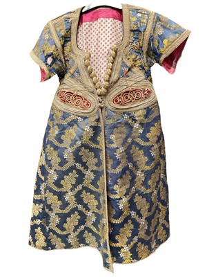 Lot 2062 - Mid 19th century silk brocade kaftan, possibly Moroccan, metallic thread braids and toggle fastenings, printed cotton lining.