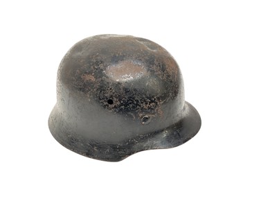 Lot 724 - Second World War Nazi German M35 helmet with black painted finish and canvas lining.