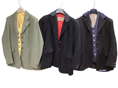 Lot 1192 - Two ladies vintage black hunting coats with Essex Hunt buttons, one with matching brass buttons and a tweed riding jacket with waistcoat