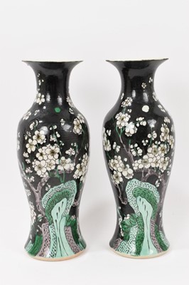Lot 143 - Pair of late 19th century/early 20th century Chinese famille noire vases, 29.5-30cm high