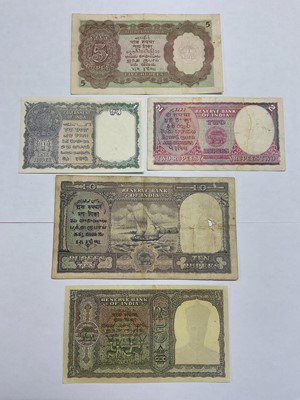 Lot 417 - India - British Raj Reserve Bank of India George VI mixed banknotes to include Obv: Facing bust types 10 Rupee C.D. Deshmukh 1943, blue-violet & olive (N.B. Holed) otherwise GF, 5 Rupee C.D....